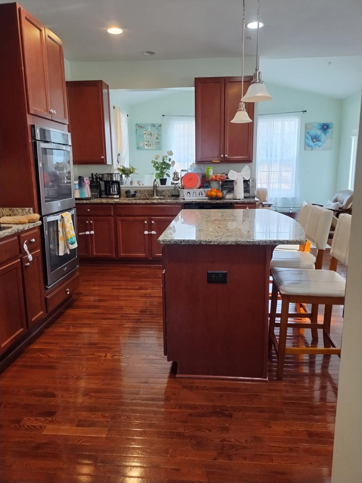 House cleaner wiping and disinfecting surfaces